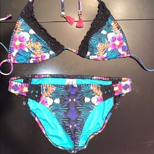 Never been worn.  Nannette Lepore jungle bikini
